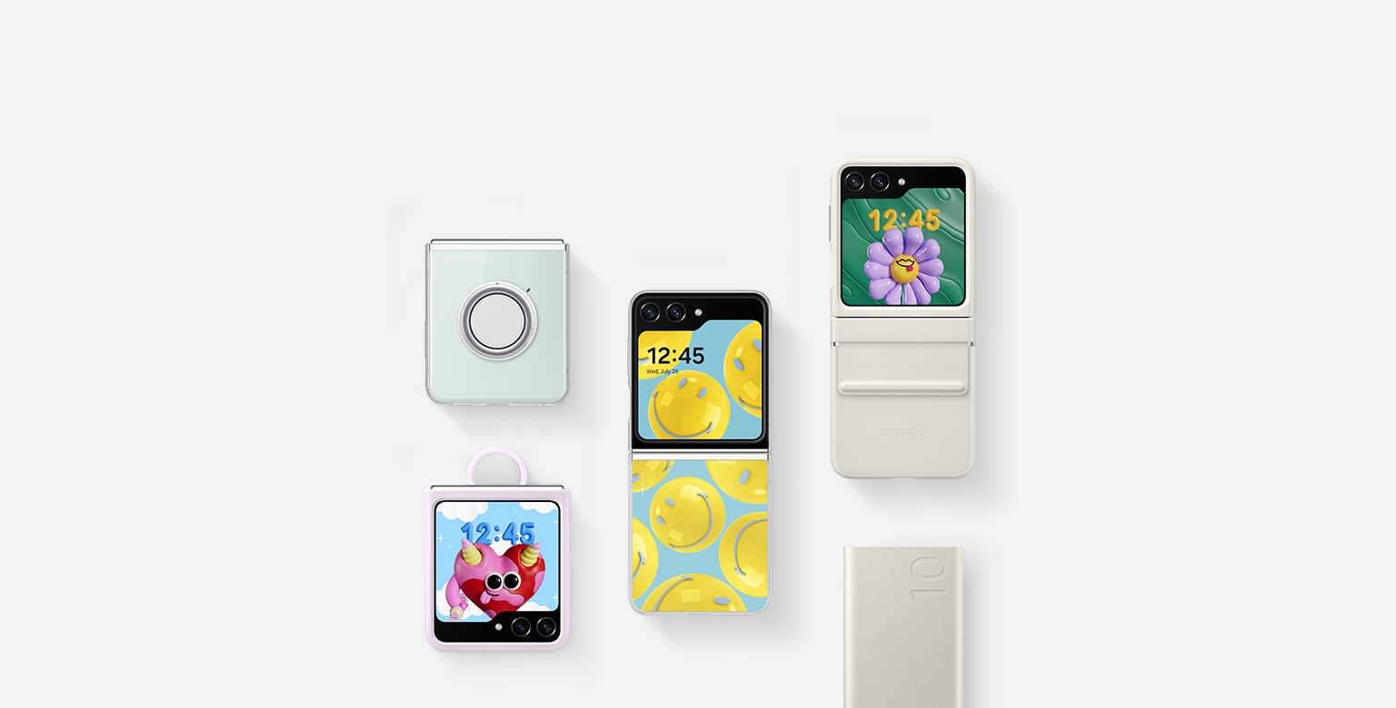 A flat lay of accessories for Galaxy Z Flip5: a battery pack, Galaxy Z Flip5 with the Clear Gadget Case installed, Galaxy Z Flip5 with the Silicone Case with Ring in Lavender installed, Galaxy Z Flip5 with the Flap Eco-Leather Case in Cream installed and Galaxy Z Flip5 with the Flipsuit Case with a smiley face card installed.