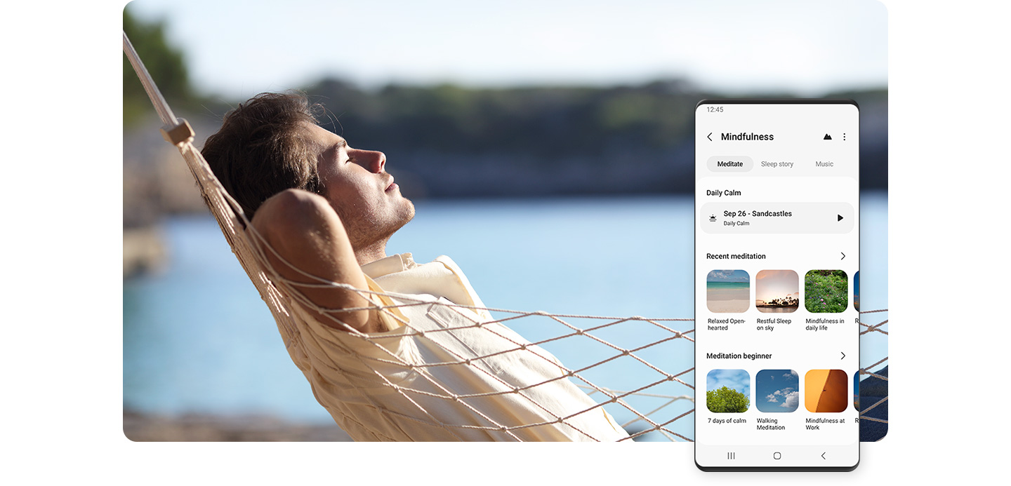 Galaxy smartphone shown displaying various Mindfulness meditation exercise videos. Behind the smartphone, a man is shown relaxing in a hammock by a lake.