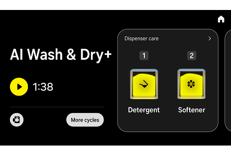 Touchscreen UI showing the AI Wash & Dry+ mode, featuring a timer set to 1:38, a ‘More cycles’ button, and two yellow-highlighted buttons labeled 'Detergent' and 'Softener.'