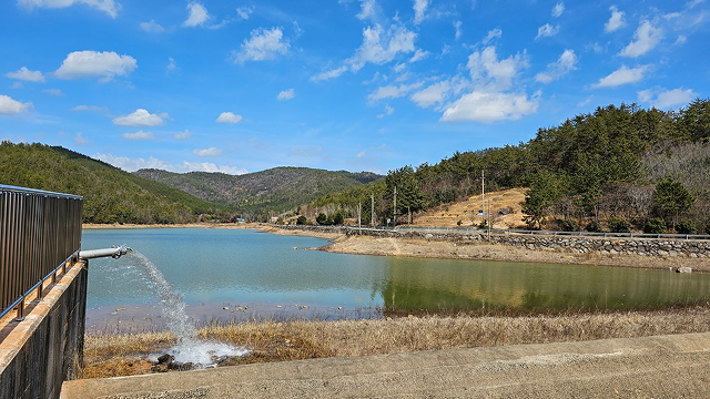 Water being discharged from a reservoir near the business site as part of aquatic ecosystem conservation efforts.