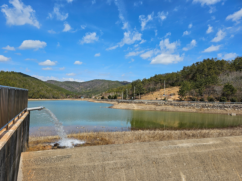Water being discharged from a reservoir near the business site as part of aquatic ecosystem conservation efforts.